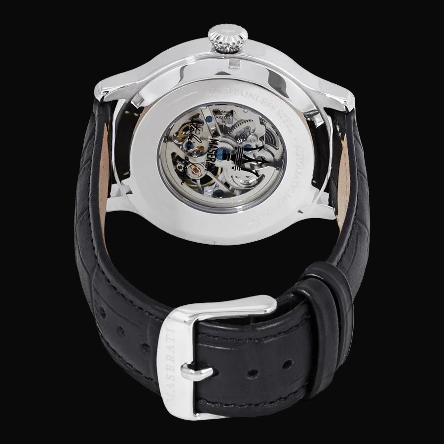 Watch with black leather strap and silver case on a white background